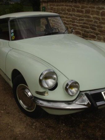 1967 Citroen DS21 in white, close up of headlights.