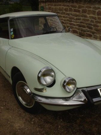 1967 Citroen DS21 in white, close up of headlights.