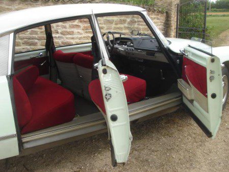 1967 Citroen DS21 with driver and passengers doors open.