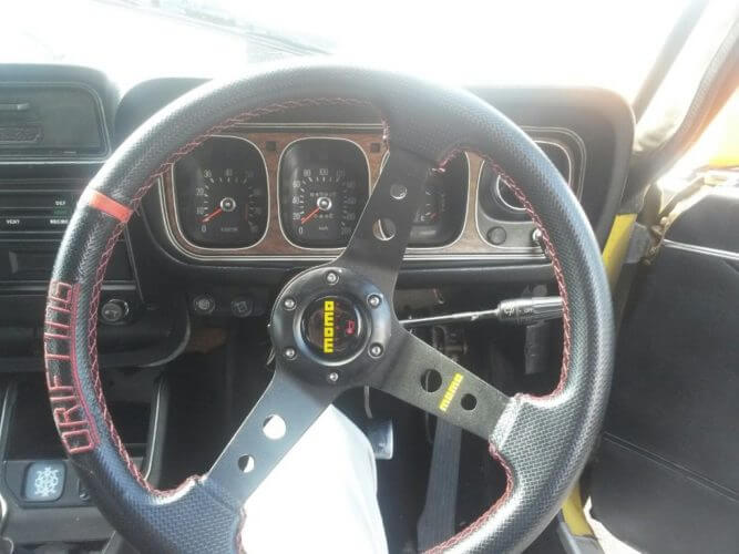Momo steering wheel in a 1973 Dodge Colt GS Coupe