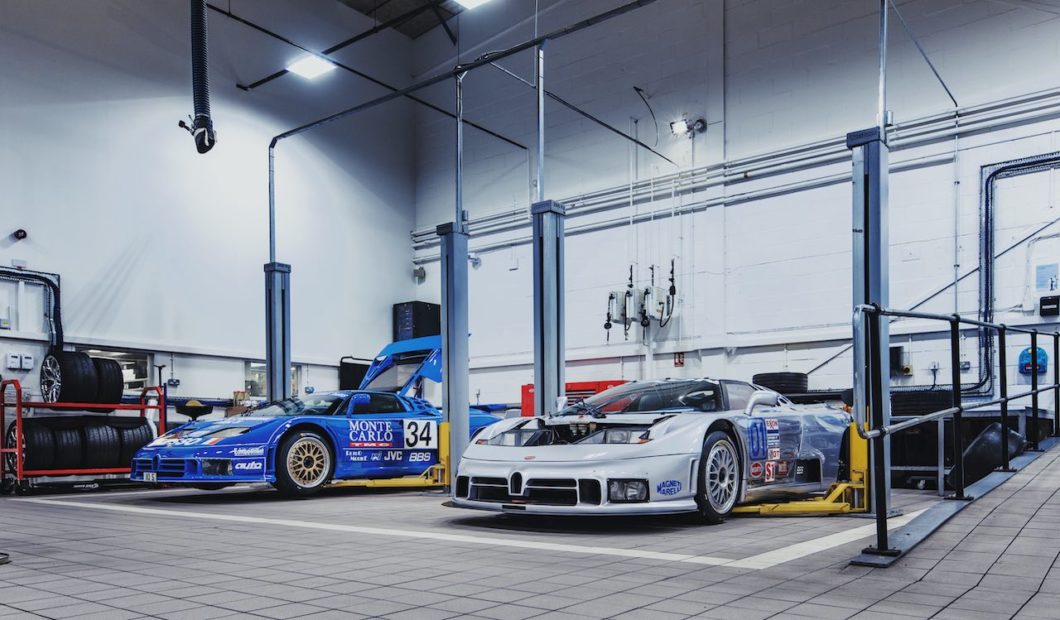 Two Bugatti EB110 race cars arrive at H.R. Owen Bugatti's workshop